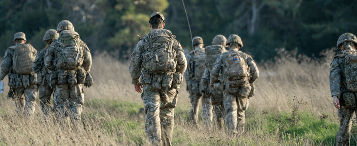 a group of military members in a field