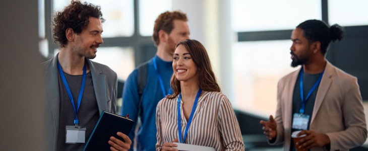 colleagues walk together in an office