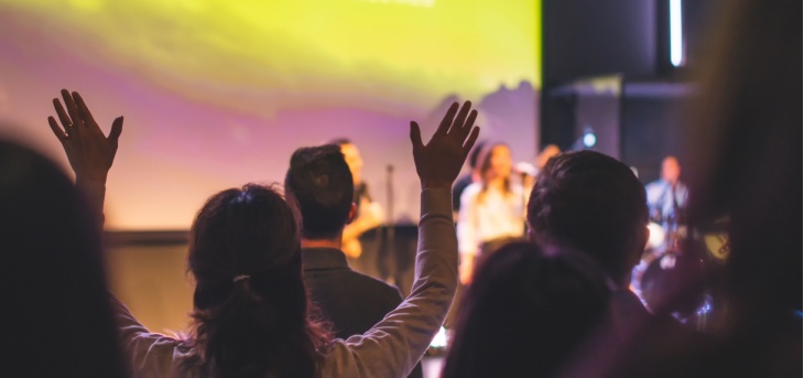 Attendees enjoy live music at a worship event
