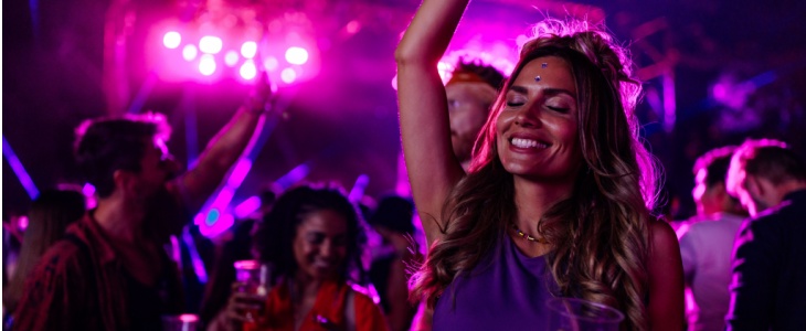 A woman dances at a concert