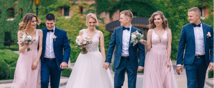 A wedding party walks together in downtown Charlotte