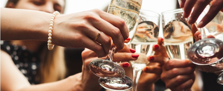 a bride toasts champagne with friends